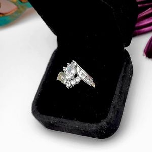 Sterling Silver ring Marquis cut center stone and surrounding cluster stones,